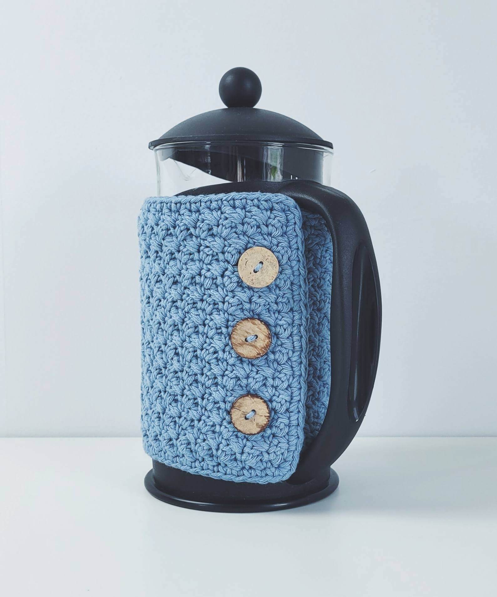 Crochet cafetiere cosy with coconut shell buttons