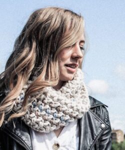 Mini bean stitch crochet cowl worn outdoors with black leather jacket